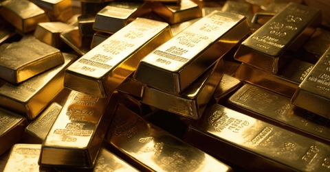 stacked of gold bars piling up