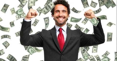 happy man enjoying in raining us dollars 
