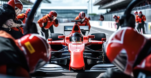pit crew ready for action as their team&#x27;s race car arrives