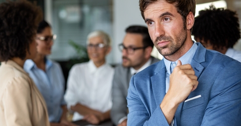 Isolated businessman lost in thoughts
