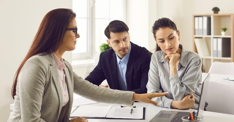 real estate explaining policies to couple