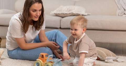 mother playing with baby boy