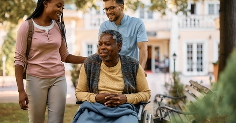Woman visiting her elderly father at the nursing home