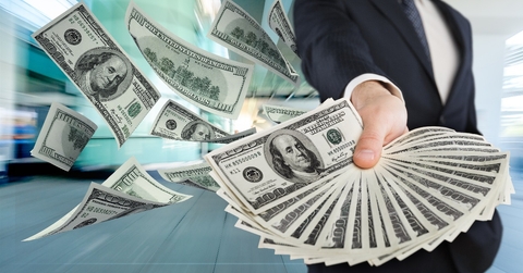 Man holding US dollars.