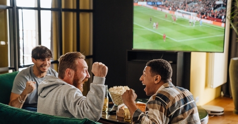 friends watching football match