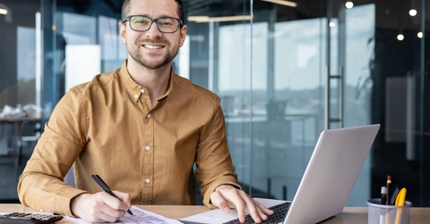 young businessman smiling at office