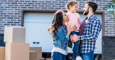 happy family outside new house