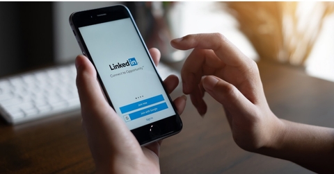 man checking linkedin app