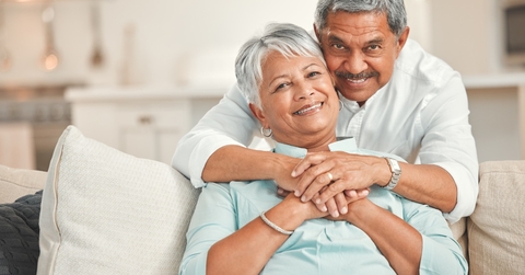 senior couple relaxing on sofa