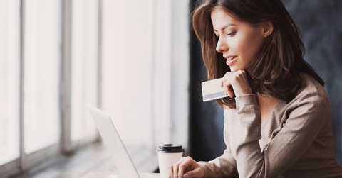 woman holding credit card