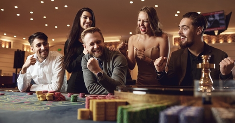 cheerful people betting at roulette poker 