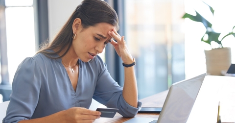 woman frustrated at credit card scam