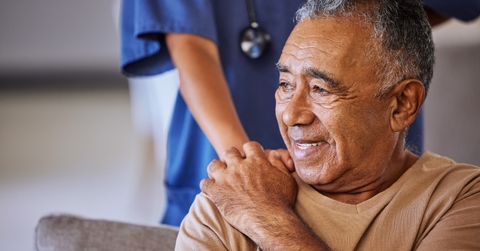 doctor offering support to senior patient