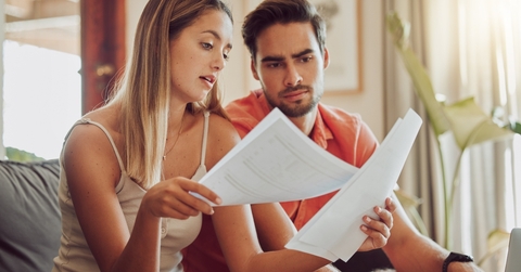 couple reading bills