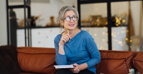 happy senior woman in glasses