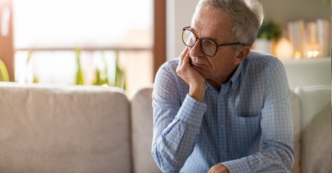 worried senior man sitting alone