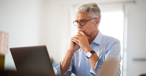 older businessman sitting in office
