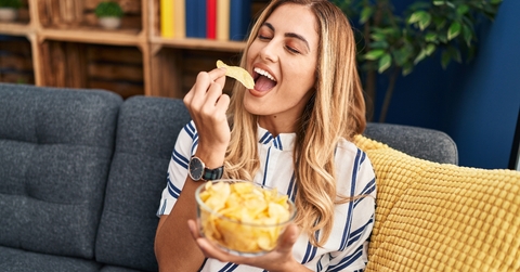 woman eating chips potatoes