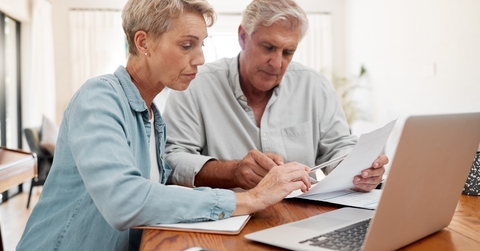 senior couple reviewing mortgage expenses together