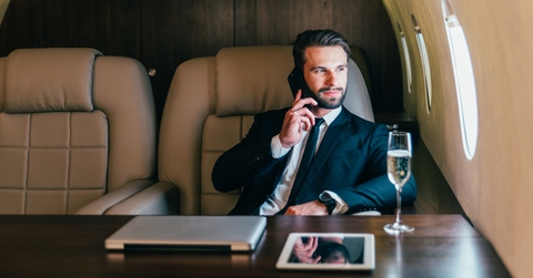 businessman flying on his private jet