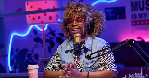A woman recording a podcast episode