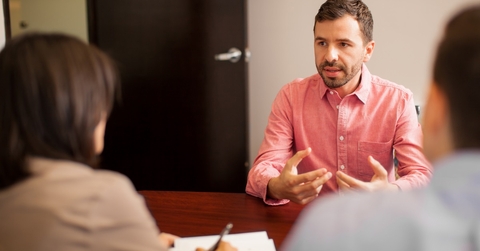 Young man being interviewed for a job position.