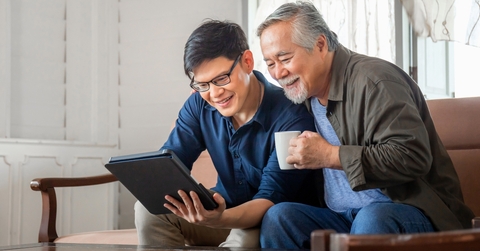 adult son using tablet smartphone
