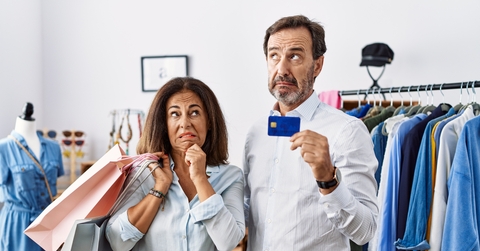 couple holding shopping bags