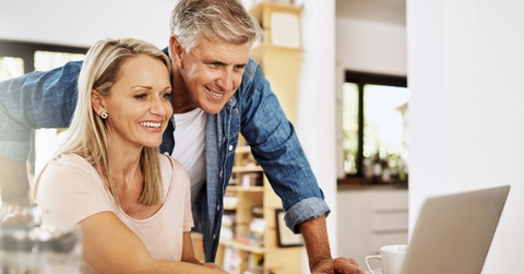 mature couple researches at home