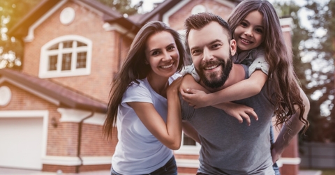 happy family outside new house