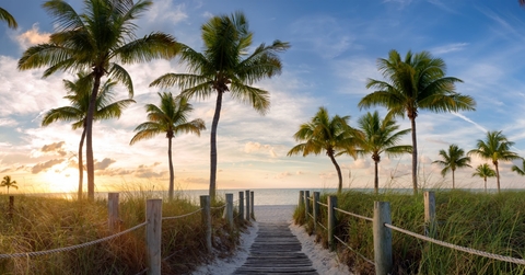 footbridge to smathers beach at sunrise