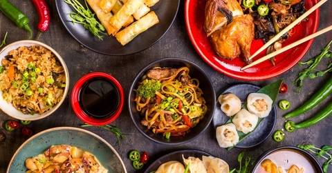 chinese dishes at table with sauces