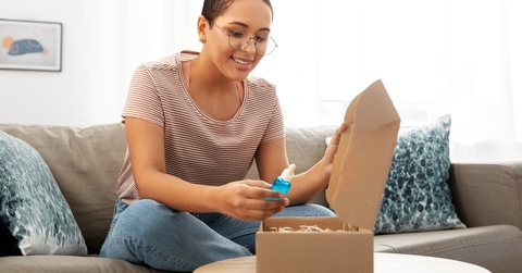 woman opening parcel box