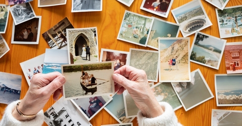 senior woman looking at old photos