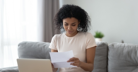 student reading paper letter