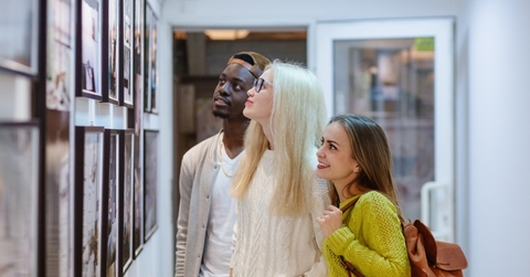 multi ethnic friends at art gallery