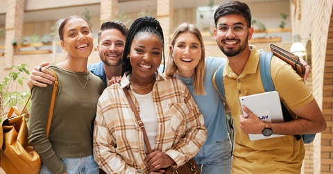 A diverse group of students smiling at the camera