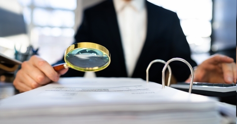 lawyer reviewing tax audit papers