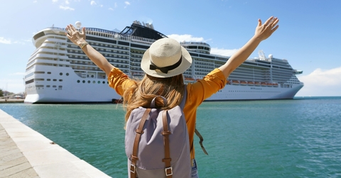 traveler girl with raised arms