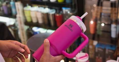 customer holding pink stanley tumbler