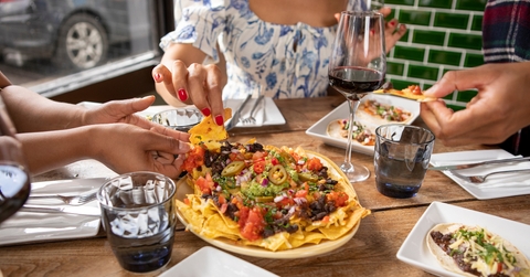 friends enjoying Mexican food 
