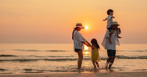 asian couple enjoying beach holiday