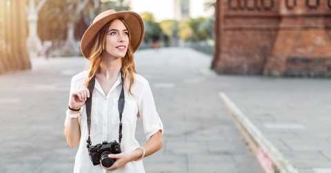 traveler holding a vintage camera