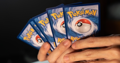 man playing pokemon card