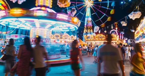 unfocused scene of a crowd at theme park