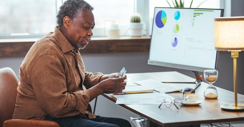 stressed senior man paying bill