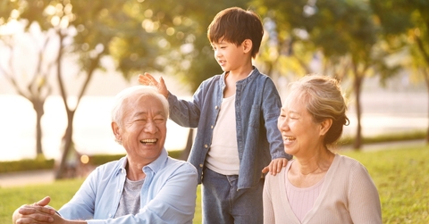 asian grandparents enjoying with grandson