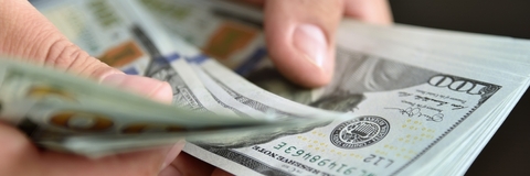 counts money in hands