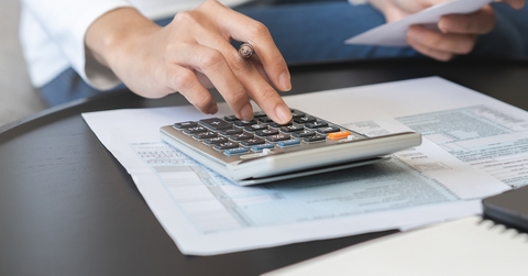 woman calculating deductions