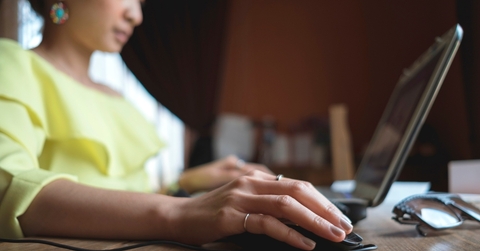 hands working with a laptop